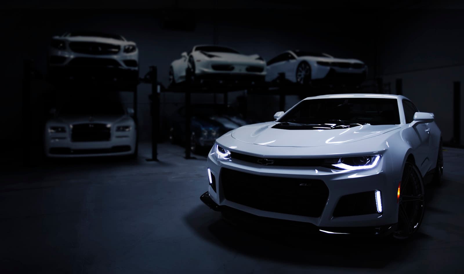 Luxury vehicles in a Web2Autos partner showroom